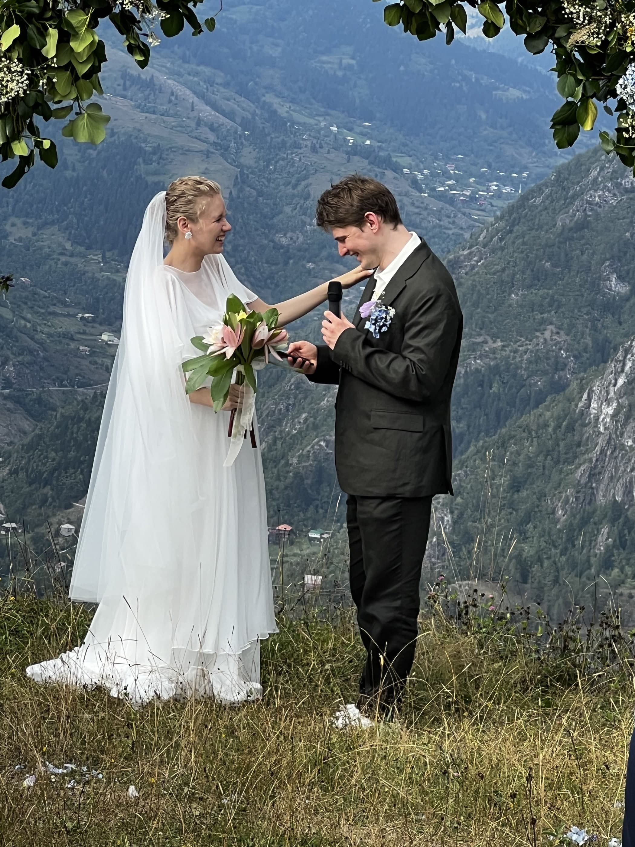 Bride and groom at a small mountain wedding ceremony, Glamping Tago, Georgia.